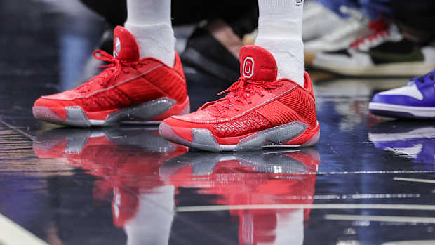 Minnesota Timberwolves guard Mike Conley's scarlet and grey Air Jordan sneakers.
